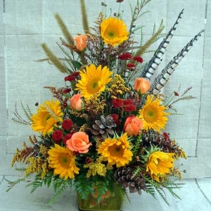 Sympathy piece with sunflowers and pheasant feathers