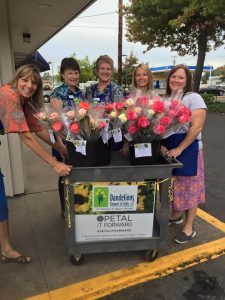 Employees at Dandelions, Flowers and Gifts get ready to spread some joy in Eugene, Oregon. 