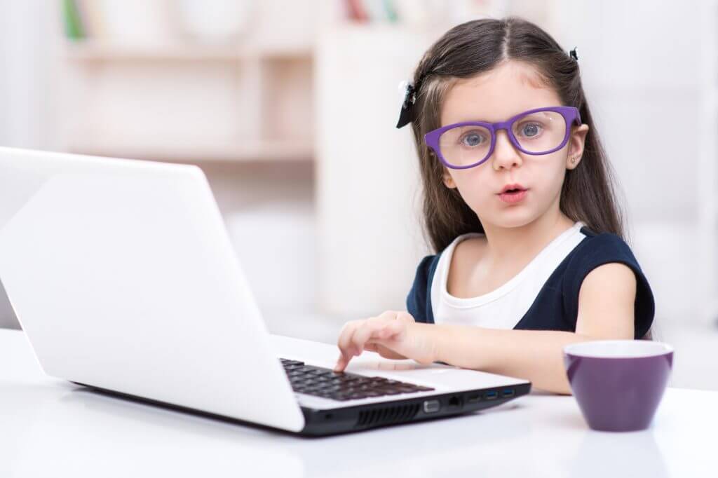 Little dark-haired girl playing role of business woman