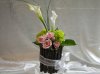 vase covered with twigs for head table.jpg