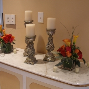 foyer designs of candles, red roses, orange roses, mango callas, hot pink r
