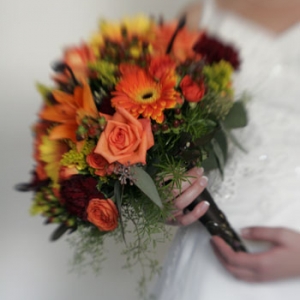 Late summer wedding bouquet in posy pocket