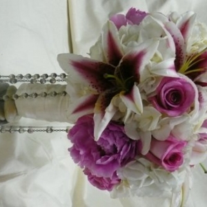 Trinity Flowers Pink Peonies, Stargazer lilies and rosary portrait bouquet