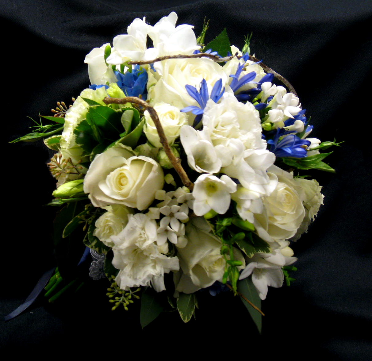 Blue, white and twig wedding flowers