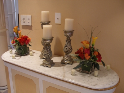 foyer designs of candles, red roses, orange roses, mango callas, hot pink r