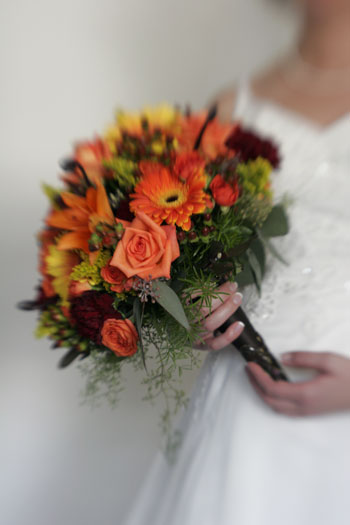 Late summer wedding bouquet in posy pocket