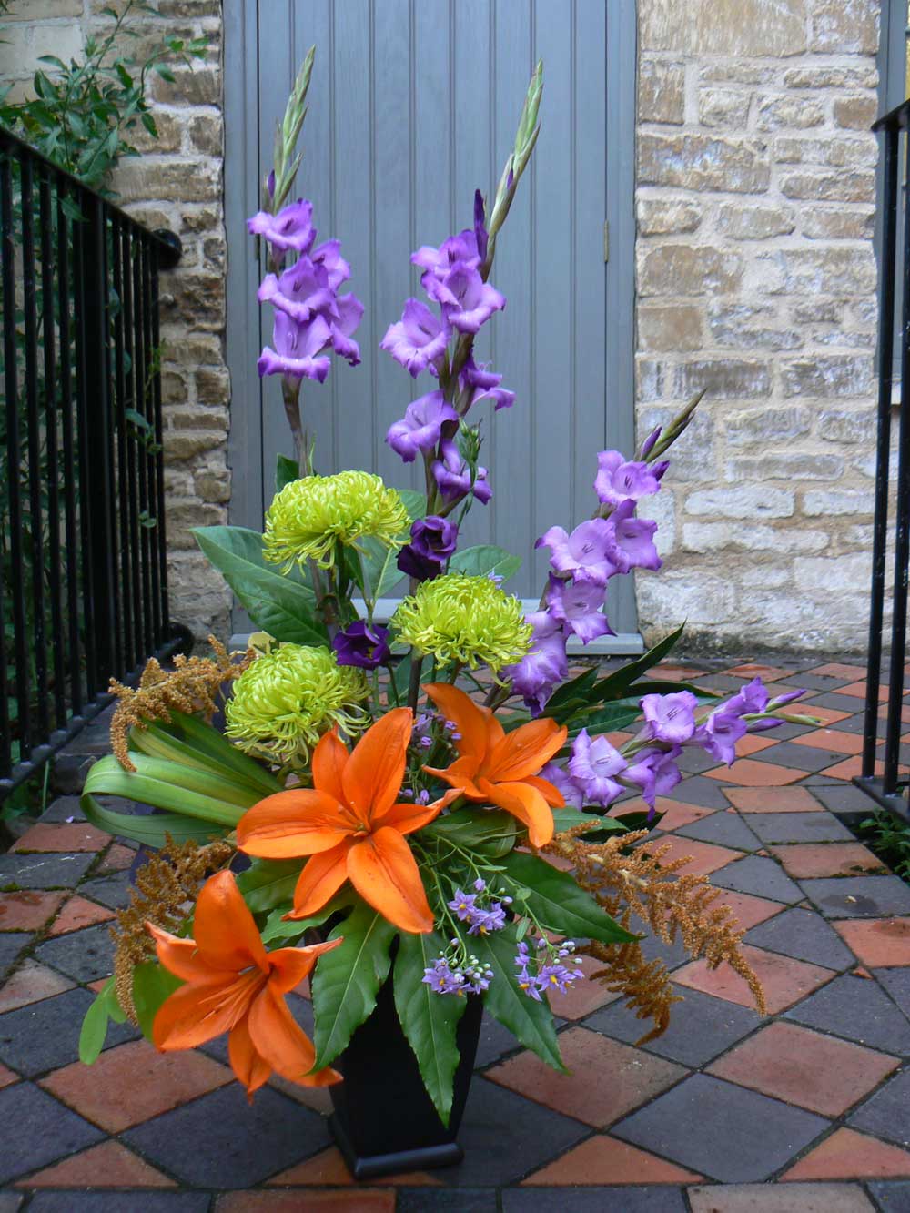 Purple Gladioli and Orange Lilies